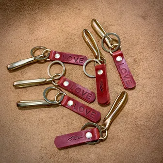 Product image of LOVE Red bison and brass fishhook keychain